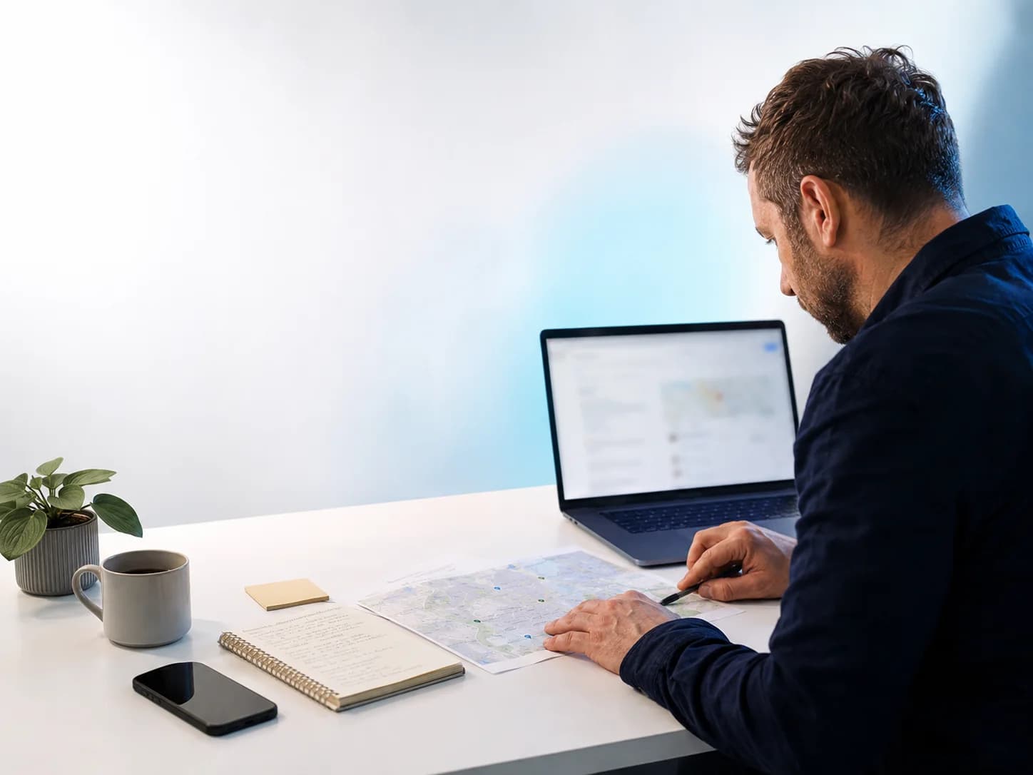 Person reviewing a local market and online information